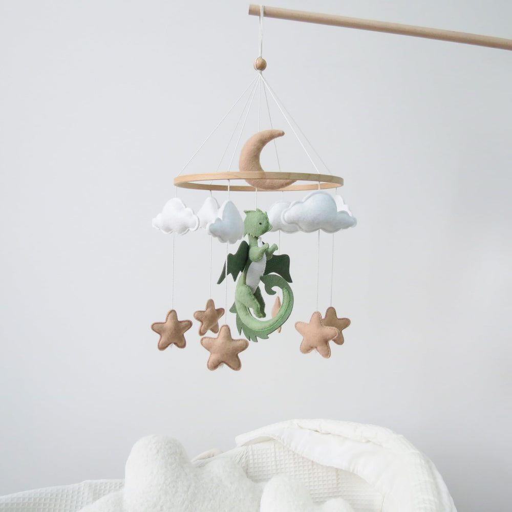 Goukurlsma dragon mobile showcases 3D dragons, clouds, and stars that captivate babies' attention.