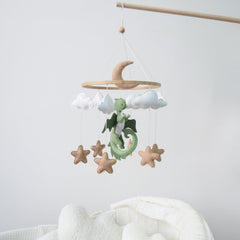 Goukurlsma dragon mobile showcases 3D dragons, clouds, and stars that captivate babies' attention.