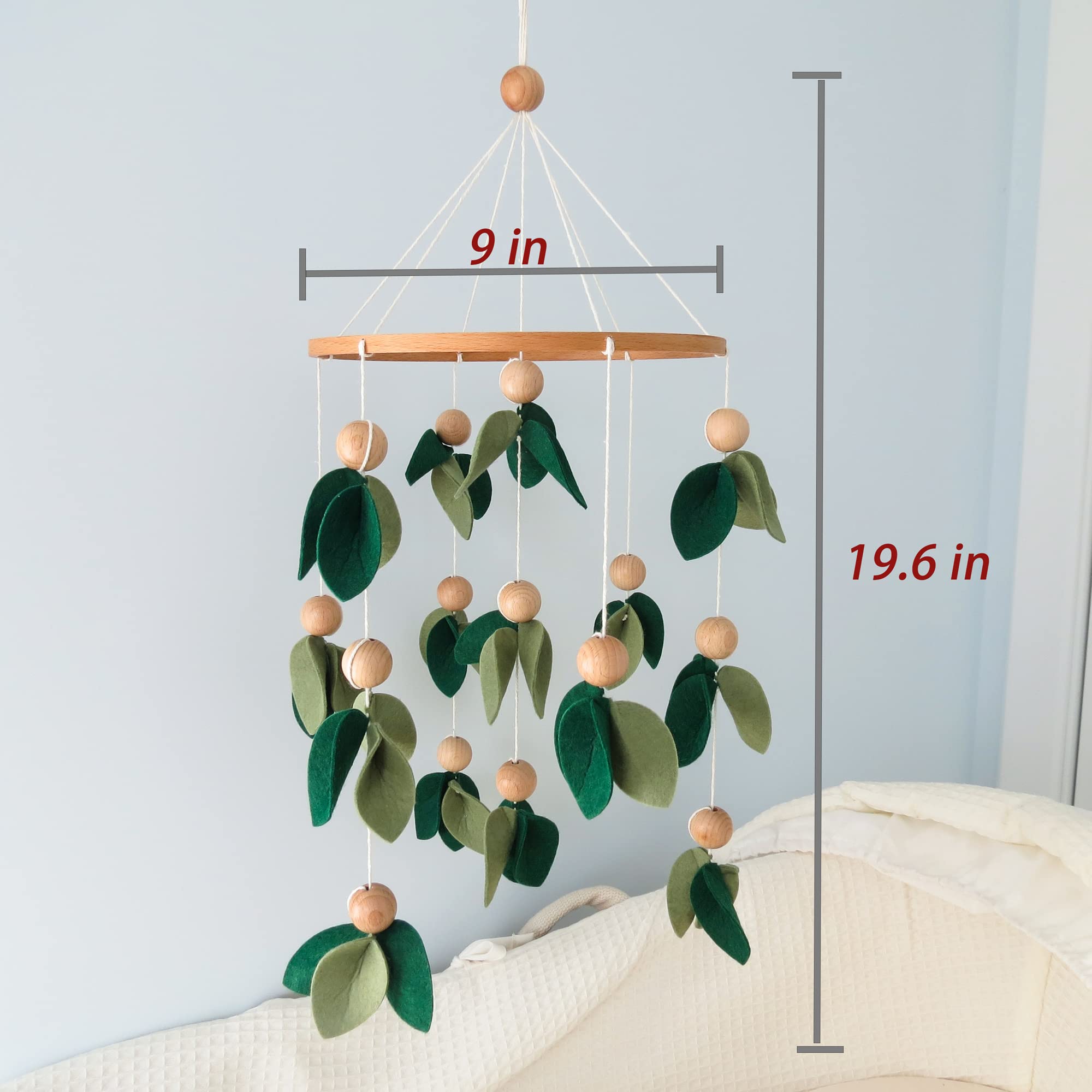 Forest-themed mobile for crib supports early color contrast in baby's view.