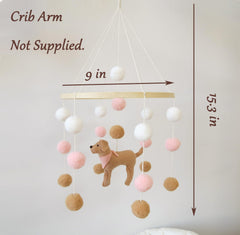 Goukurlsma pink dog-theme mobile above the bassinet adds gentle color.