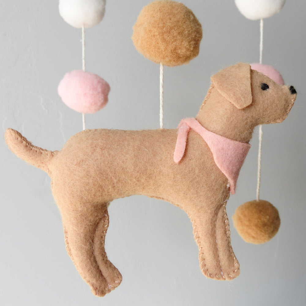 Goukurlsma puppy-theme nursery mobile enhances decor and focus.