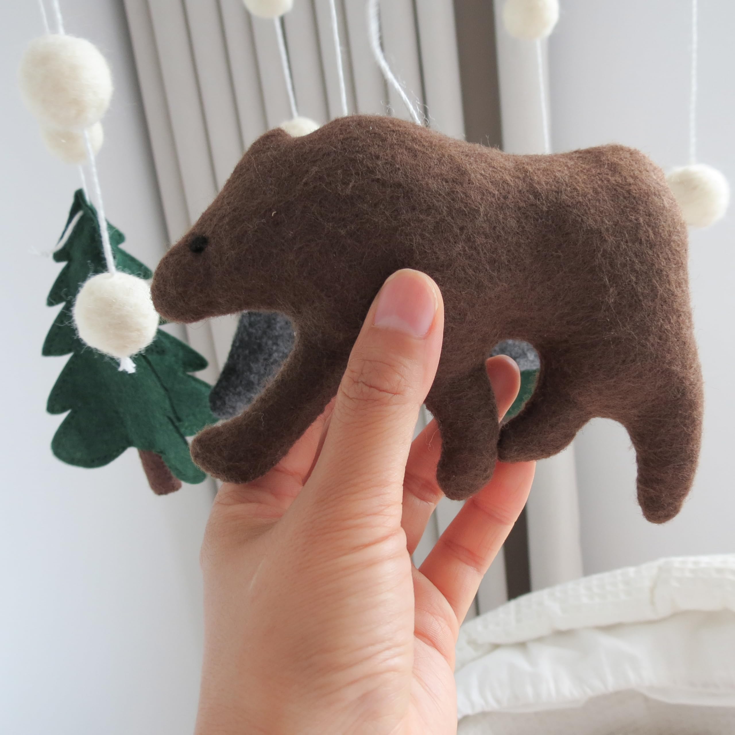 GOUKURLSMA beech ring mobile showcases wooden beads for gentle motion.