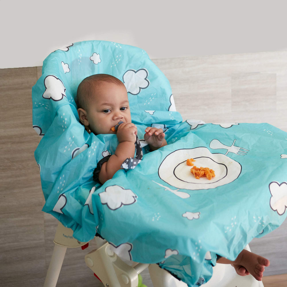 Grabease teal bib shown on high chair protecting surfaces during meals