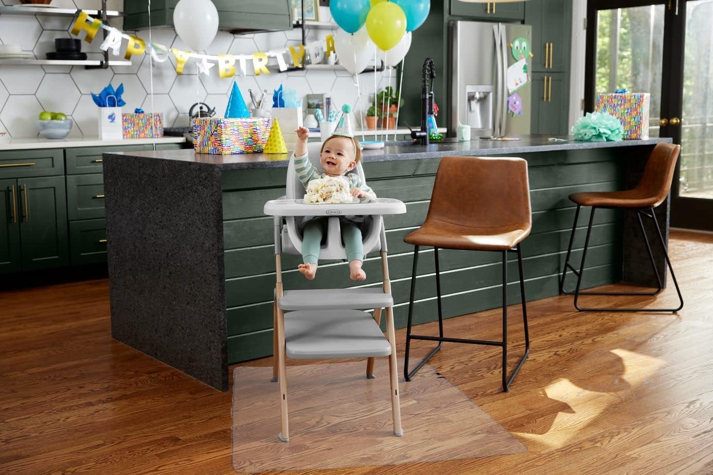 Graco 50-inch art and eating mat doubles as painting and feeding surface.