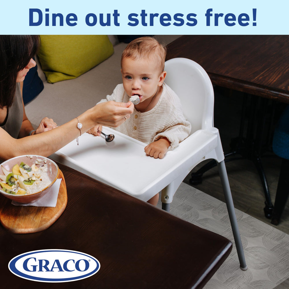 Graco mats spread on a dining floor with a baby nearby.