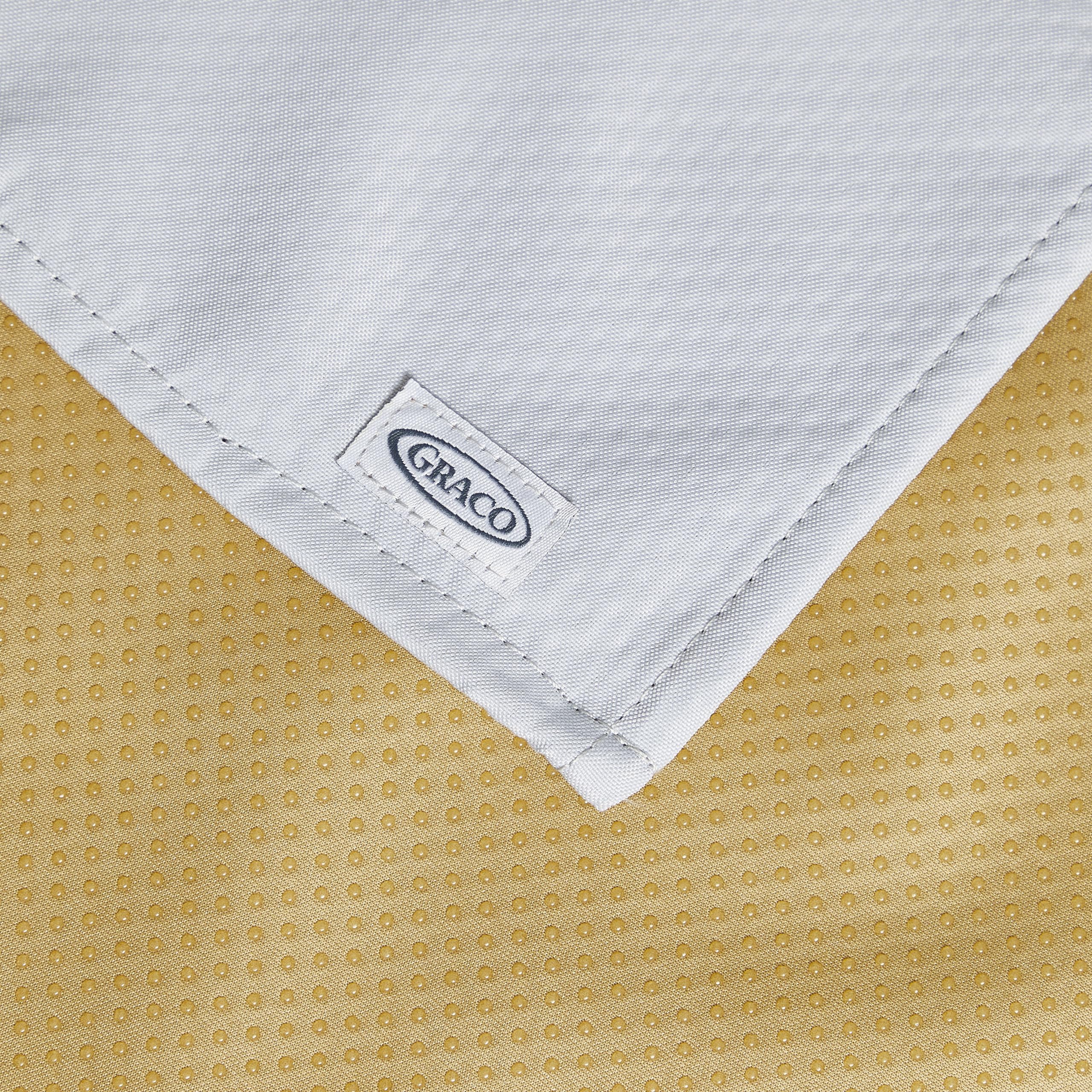 Graco splat mat is machine washable for quick cleanup.