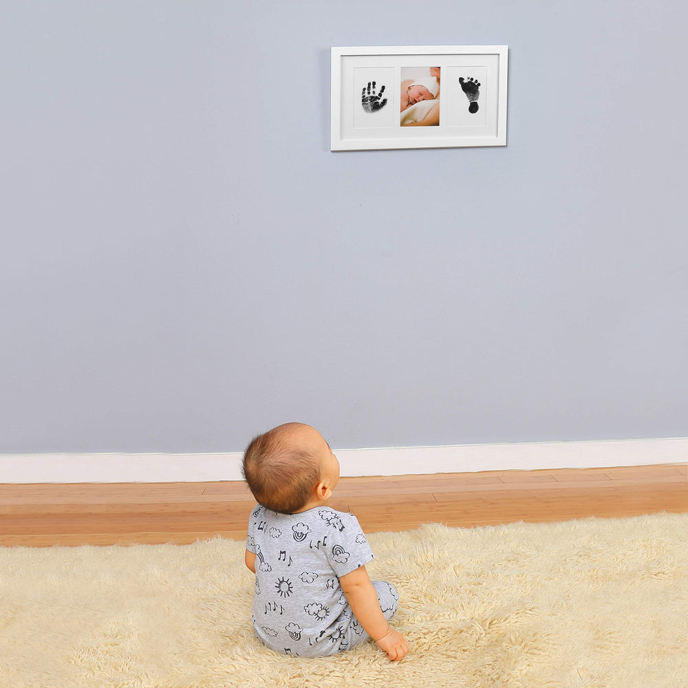Green Pollywog frame with three slots for handprint, footprint, and photo.