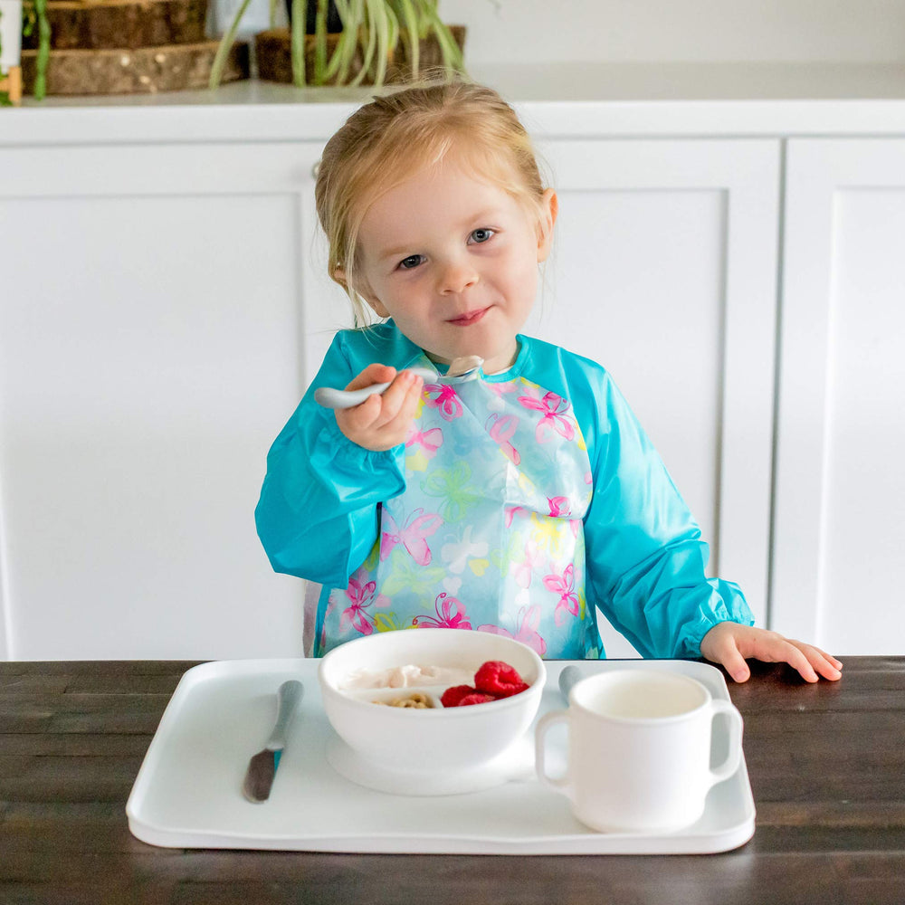 Green Sprouts roll-and-go bib with pocket for utensils on the go