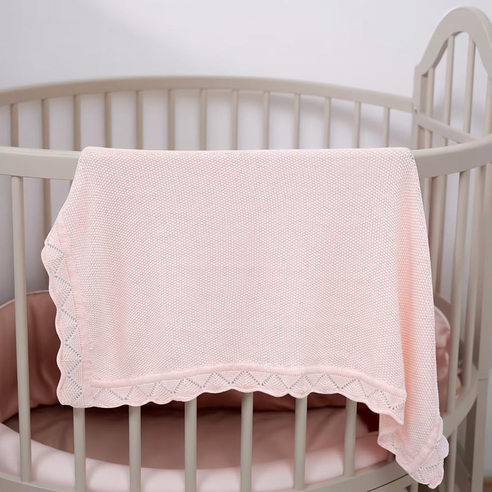 Grewear baby blanket swaddled on a newborn for calm sleep