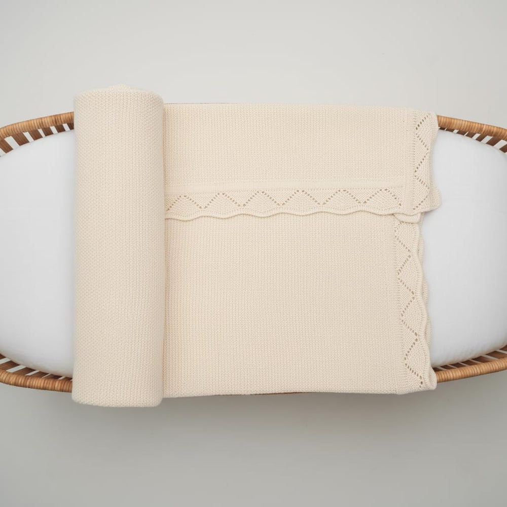 Grewear Baby Knit Blanket lacing detail adds border charm.