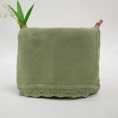 Grewear blanket close-up shows soft knit texture for cozy newborn snuggles.