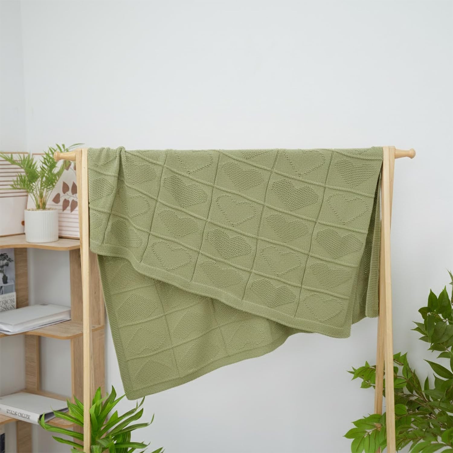 Grewear sage-green blanket complements modern nursery decor.