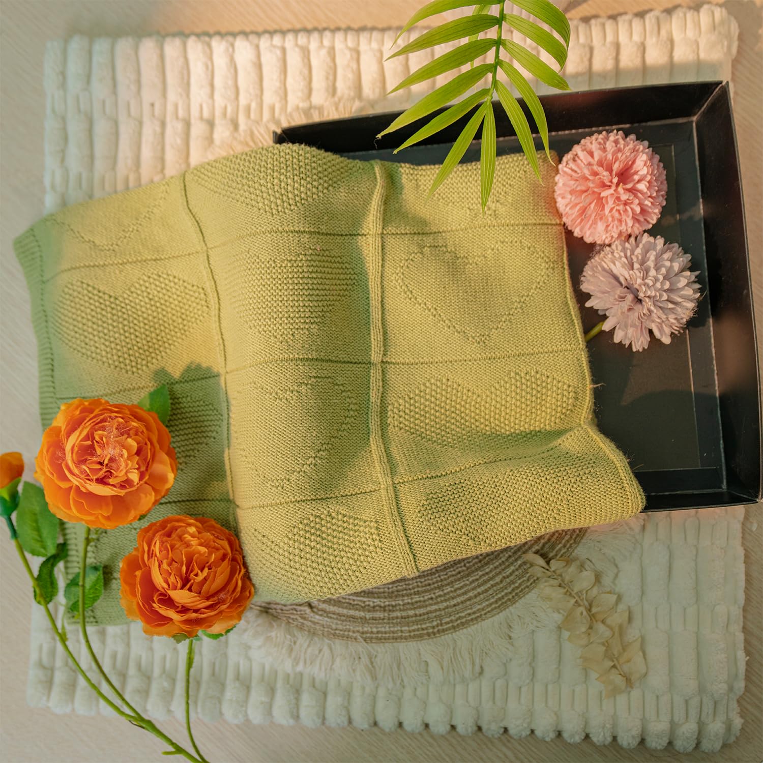 Grewear baby knit blanket offers soft texture for nurseries.