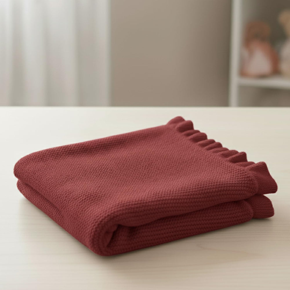 Grewear cotton baby blanket features a breathable knit for year-round use.