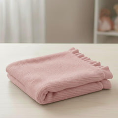 Grewear baby blanket in crib, lightweight and cozy for year-round comfort.
