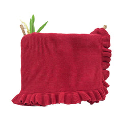 Grewear cotton baby blanket with ruffle edge adds gentle charm to crib.