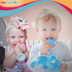 The Teething Egg Grippie Stick is held by a baby for a playful rattle.