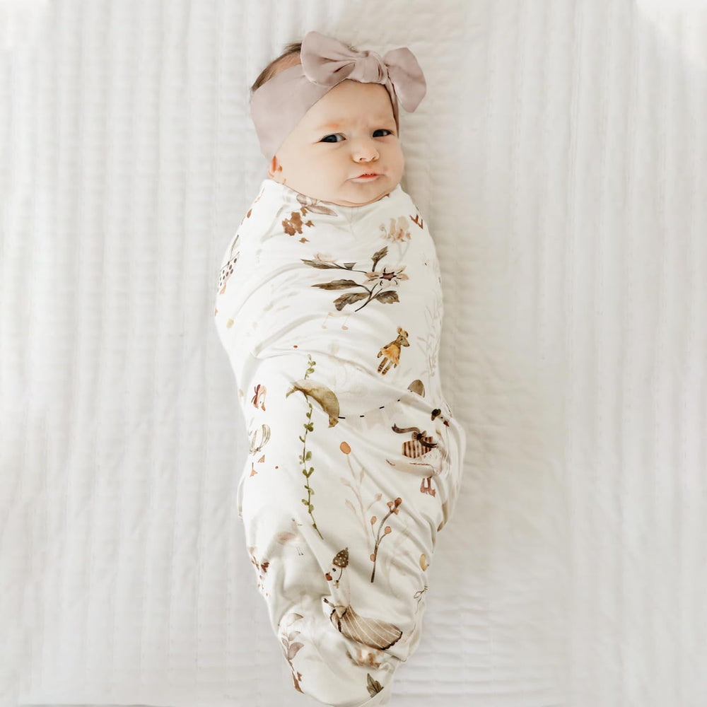 GRSSDER 34x44 blanket serves as a roomy swaddle and cozy play mat