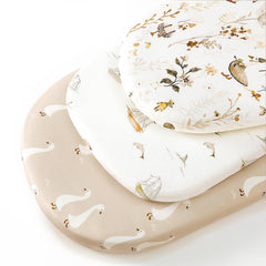 GRSSDER universal-fit bassinet sheet displaying oval and rectangle compatibility.