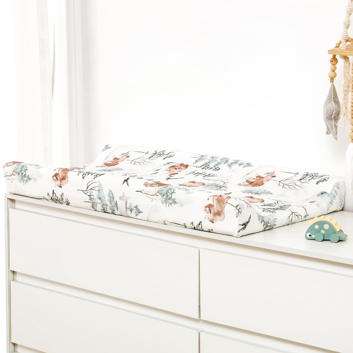 GRSSDER wolf-pattern changing pad cover shown on a standard pad.