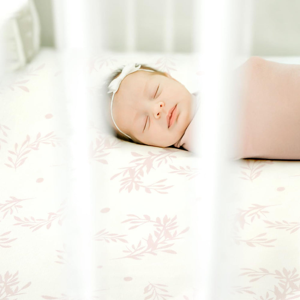 GRSSDER crib sheet brightens a nursery with serene decor and cozy feel