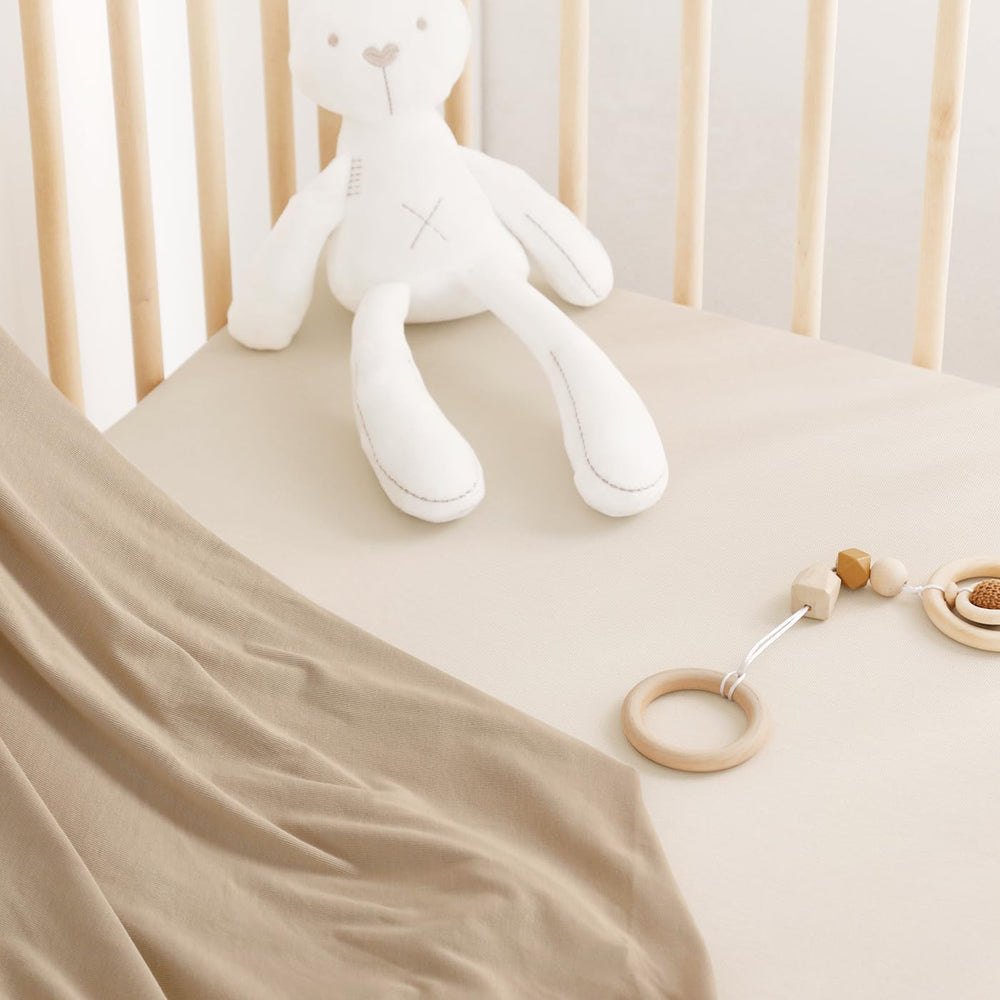 GRSSDER ultra-soft jersey crib sheet offers breathable comfort for naps and bedtime.
