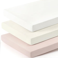 GRSSDER mini crib sheets fitted on a playard for secure soft comfort.