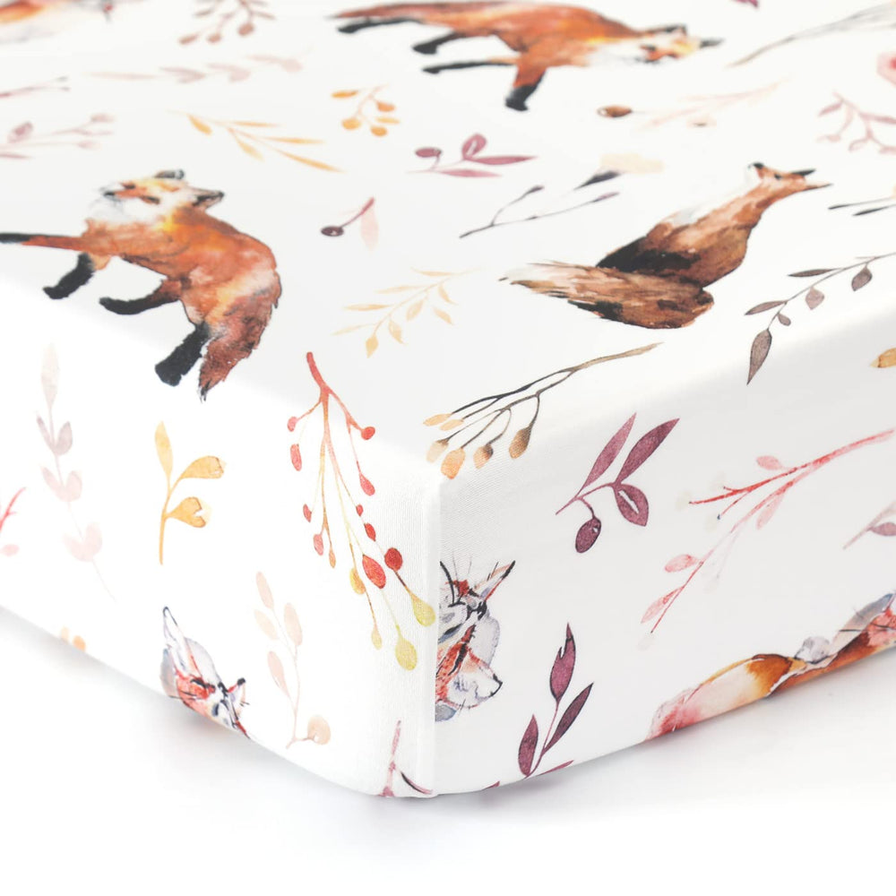 GRSSDER nursery bedding setup helps complete a serene crib look.