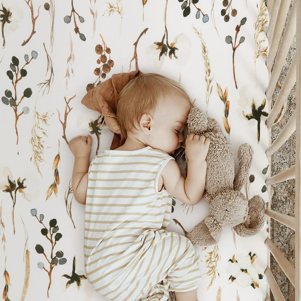 GRSSDER Pretty Flora beige pattern adds calm, stylish nursery detail.