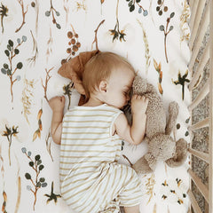 GRSSDER Pretty Flora beige pattern adds calm, stylish nursery detail.