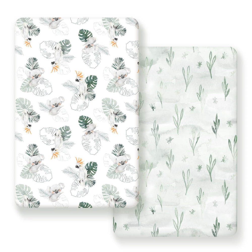 GRSSDER mini crib sheets in mint with watercolor animals for breathable comfort.