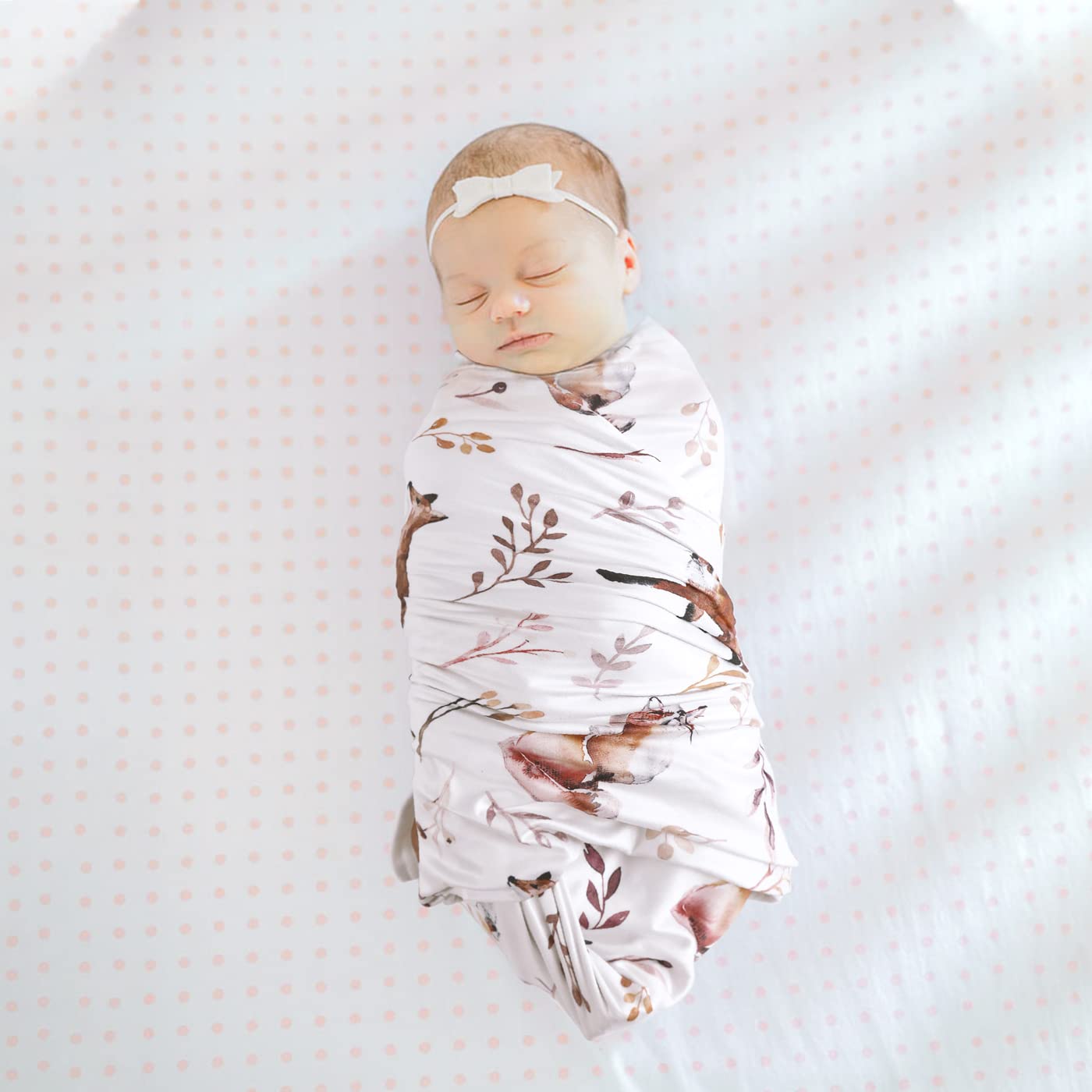 GRSSDER swaddle setup image demonstrates easy snug wraps.