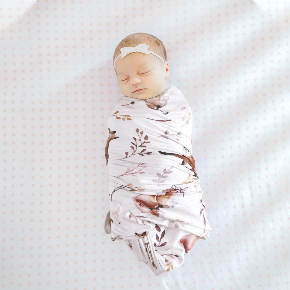 GRSSDER swaddle setup image demonstrates easy snug wraps.