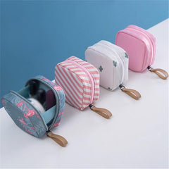 GSHLLO tampon and napkin storage in a compact travel pouch