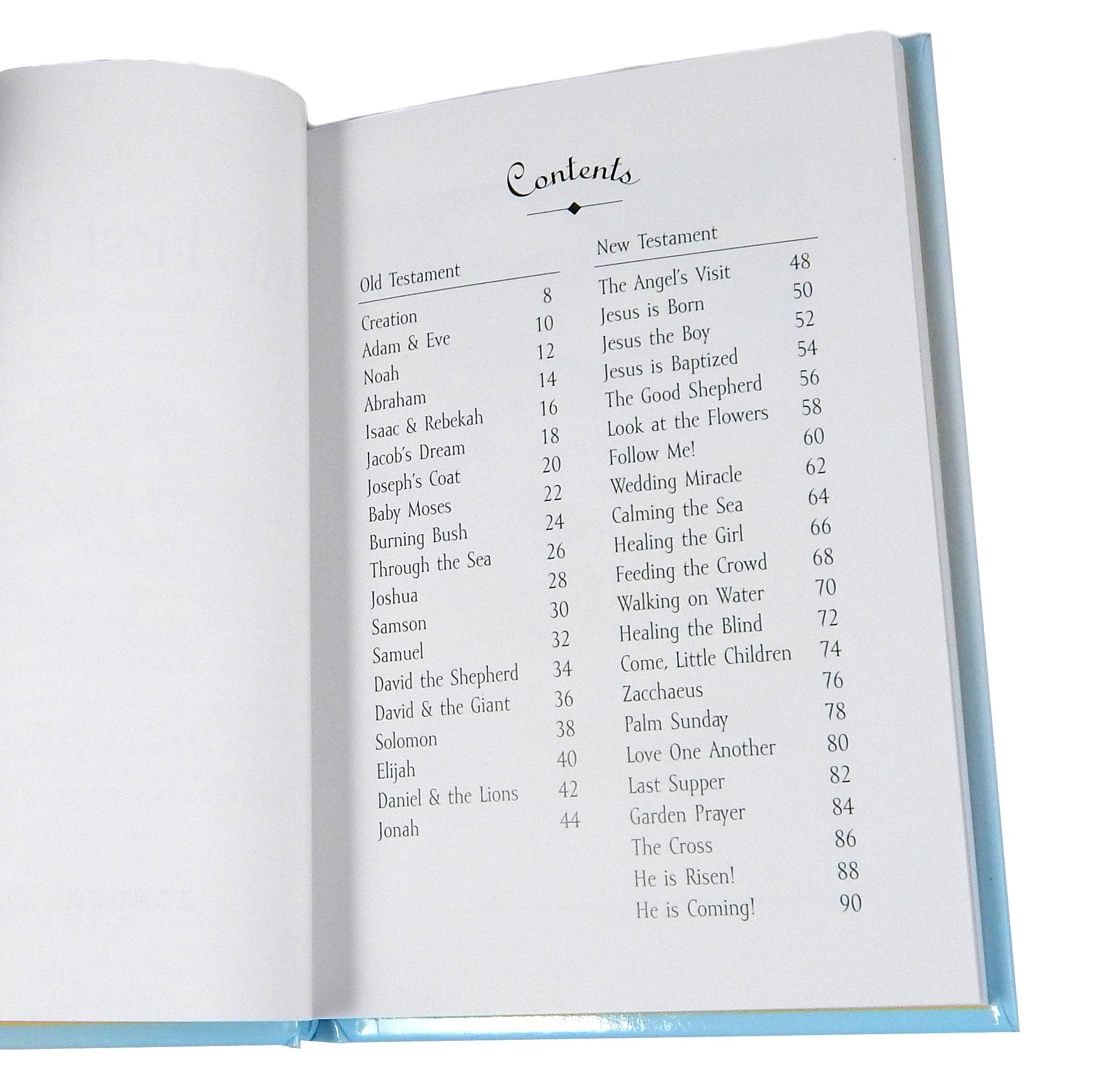 Guardian Angel crib cross in pewter accompanies the baby's first Bible, ideal for christening celebrations.