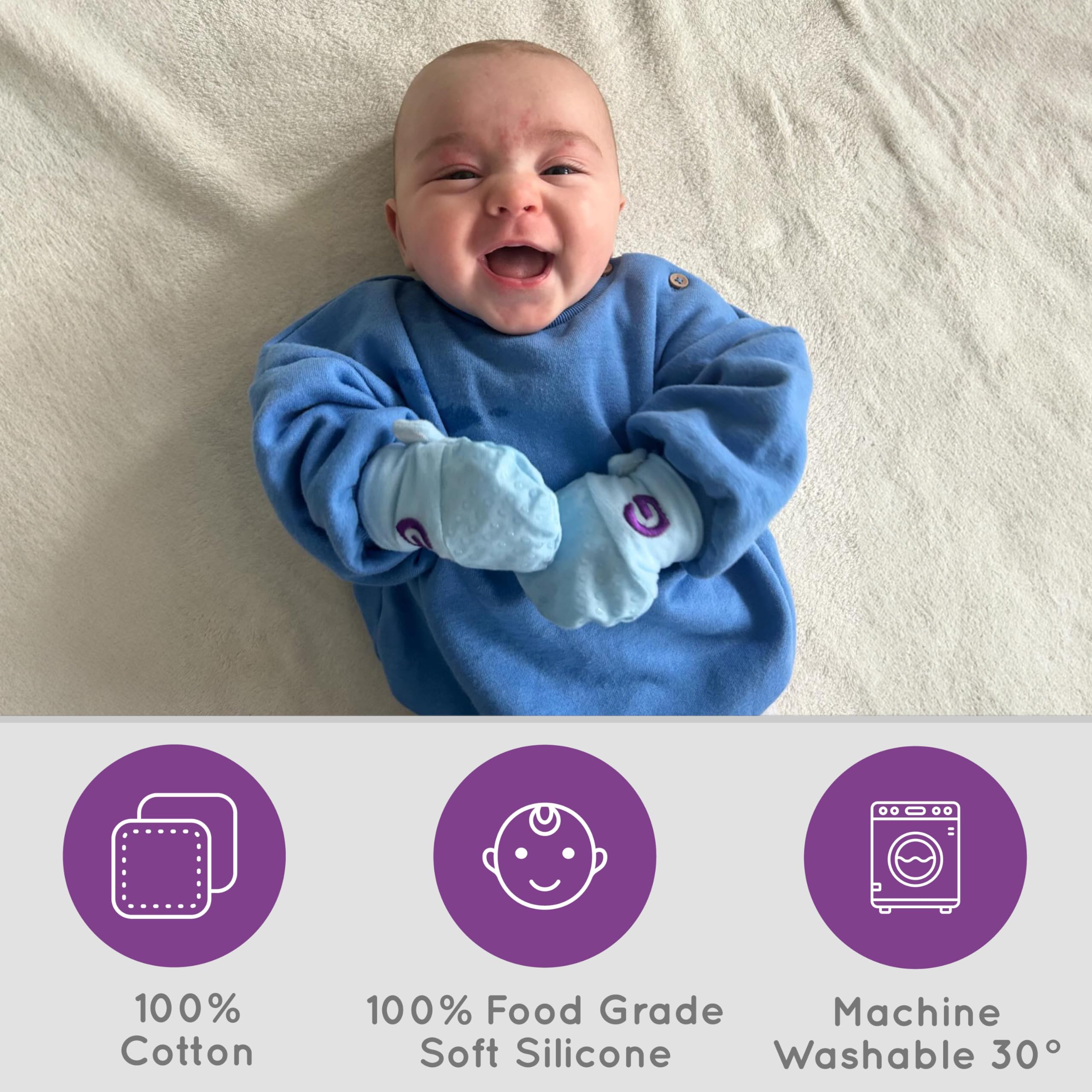 Gummee Glove Blue baby wearing mittens demonstrates safe teething wear