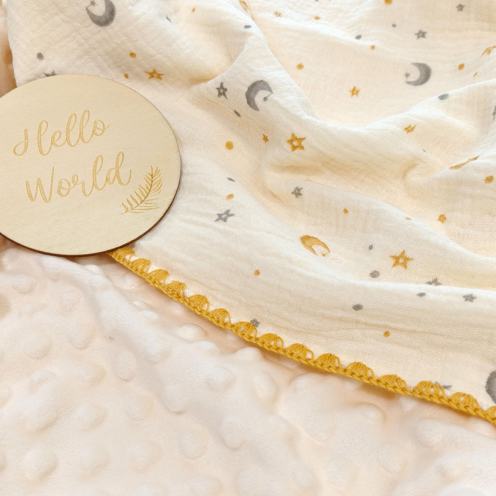 Gunnaicat baby blanket ready for swaddling, with a soft polyester back for added warmth.