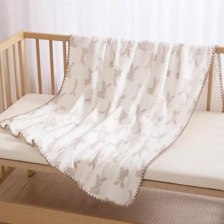 Gunnaicat baby swaddled with blanket demonstrates secure wrap and comfort.