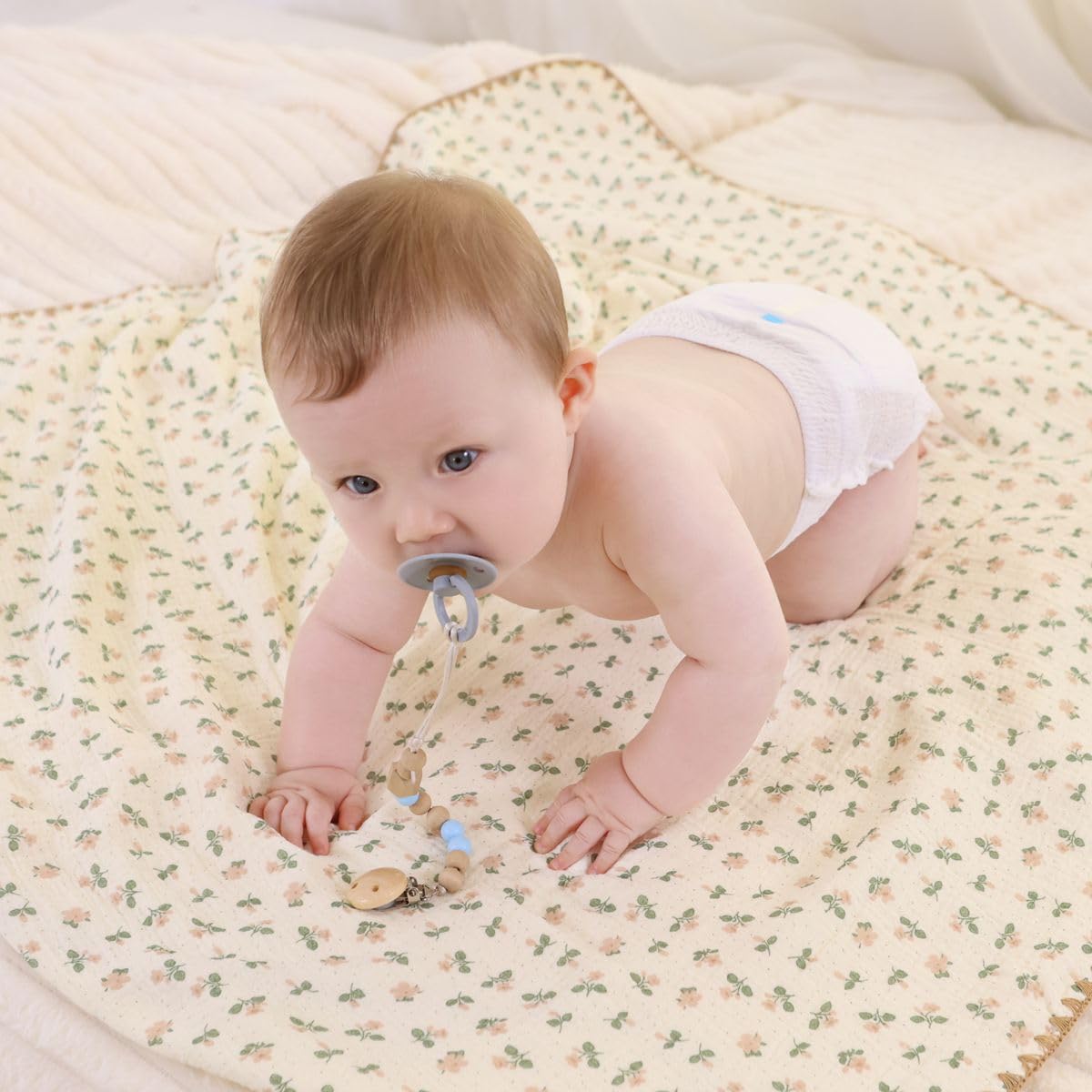 Gunnaicat nursery blanket with flowers and woven edge adds cozy style.
