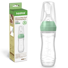 Haakaa silicone baby food dispensing spoon feeder close-up showing precise flow control for gentle feeding