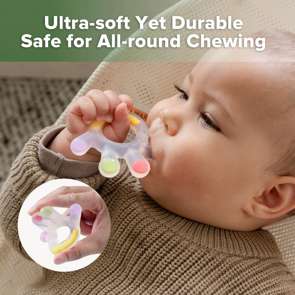 Haakaa baby holds teether, promoting motor skills