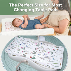 Haakaa changing pad liner in vintage garden colors folded for portable use.