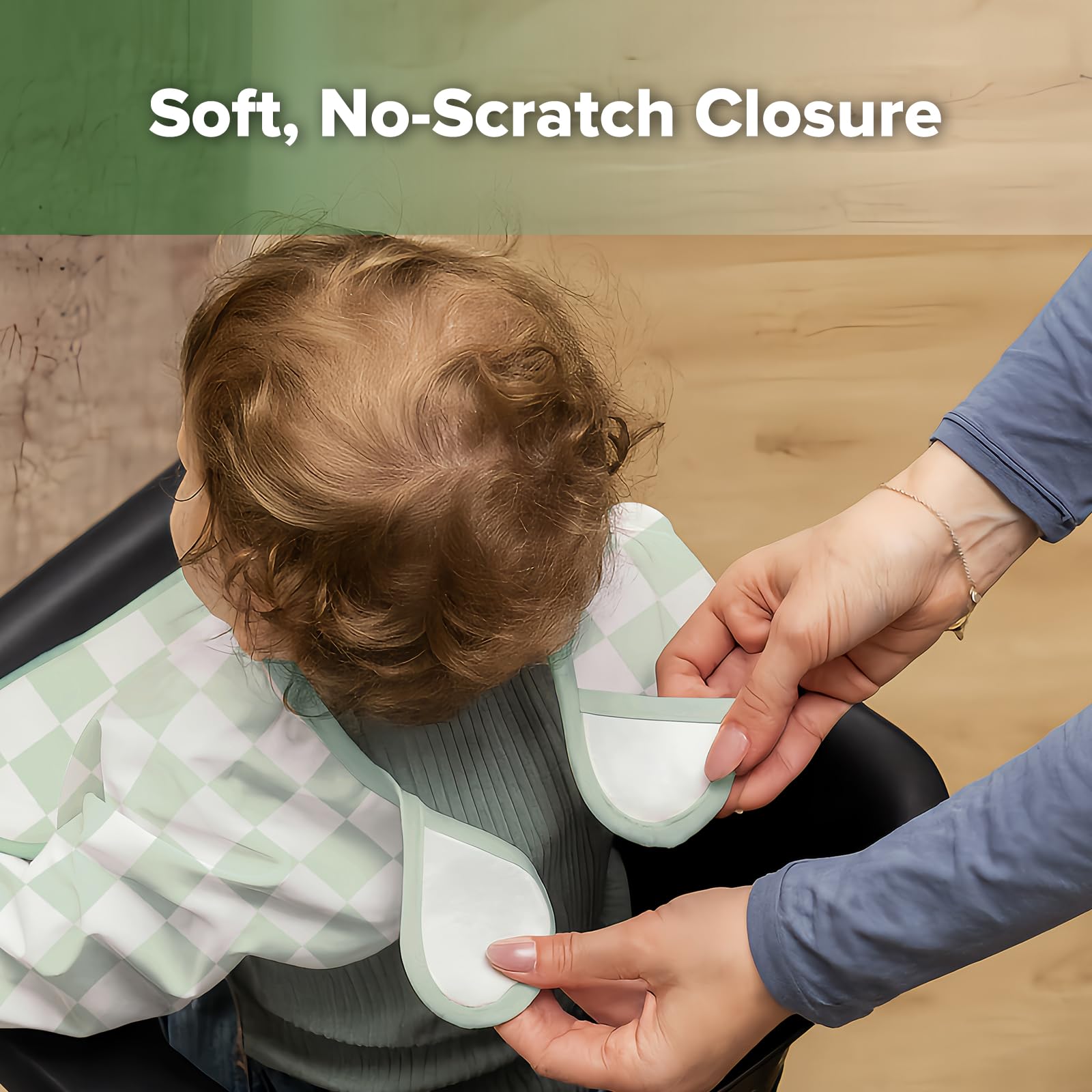 Elastic cuffs on Haakaa bib help contain messes during play.
