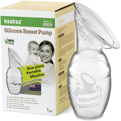 Haakaa manual breast pump in clear silicone for hands-free milk capture.