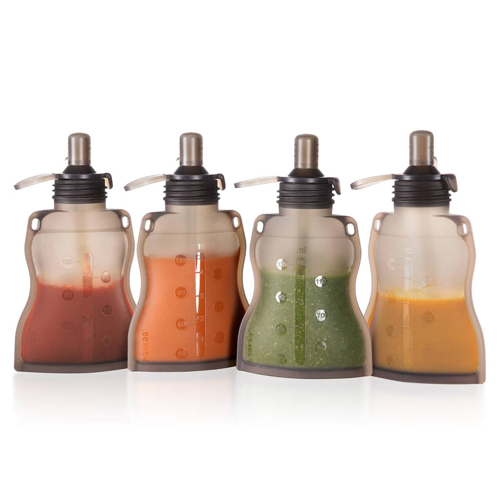 Haakaa reusable baby food pouch with lid and straw for mess-free feeding.