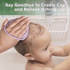 Haakaa baby hair scrubber on delicate scalp during bath.