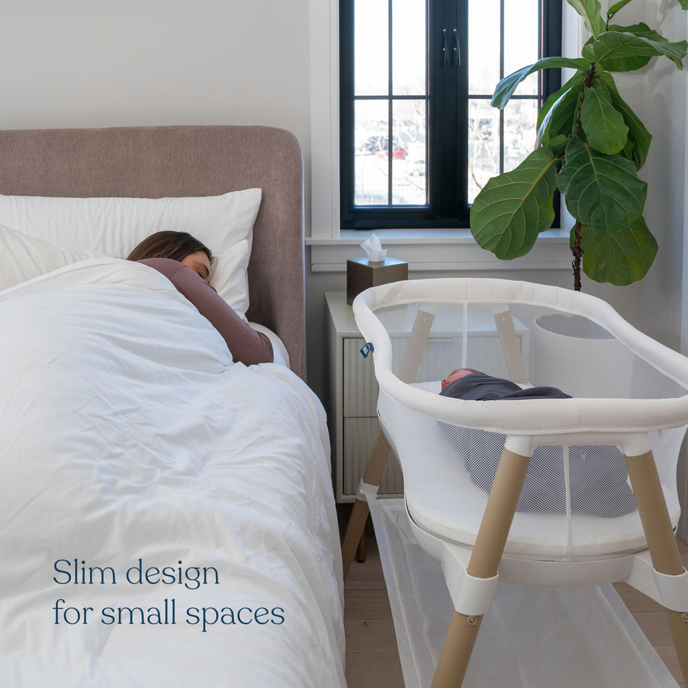 Halo BassiNest Essential Sleeper built-in shelf keeps diapers and wipes within reach.