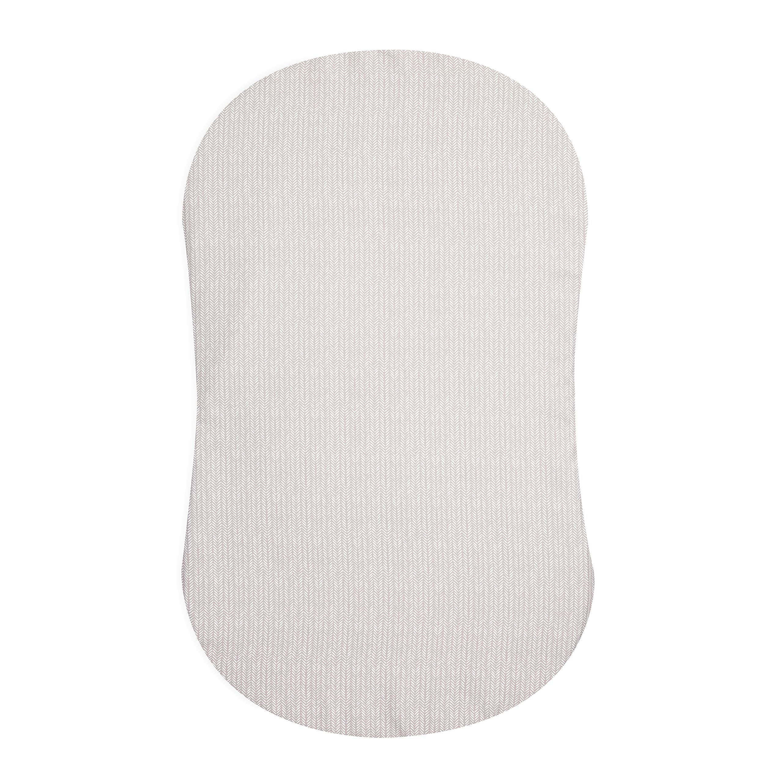 HALO BassiNest fitted sheet on pad offers secure fit and quick changes.
