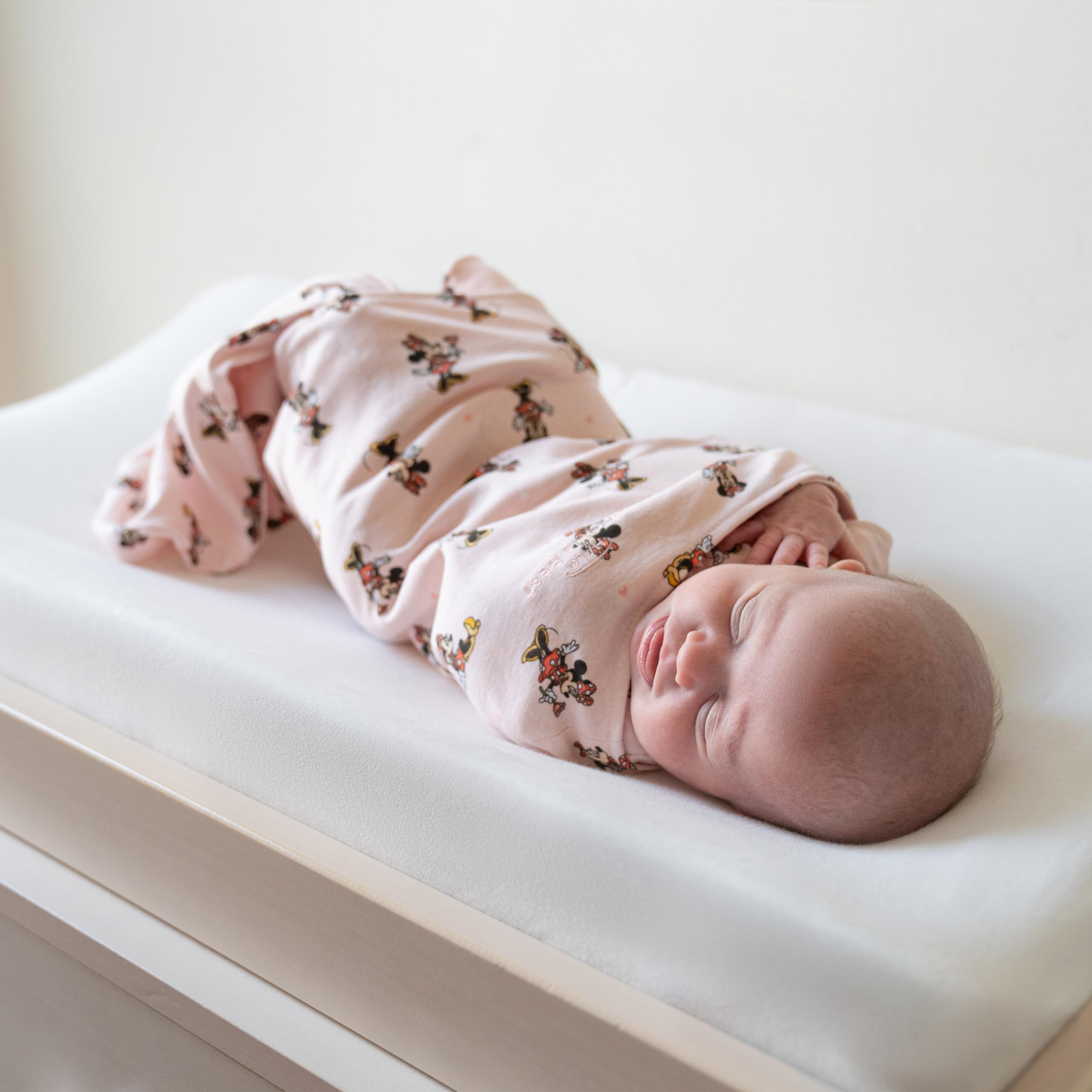 HALO Minnie Fun adjustable swaddle with arms-in and out options.