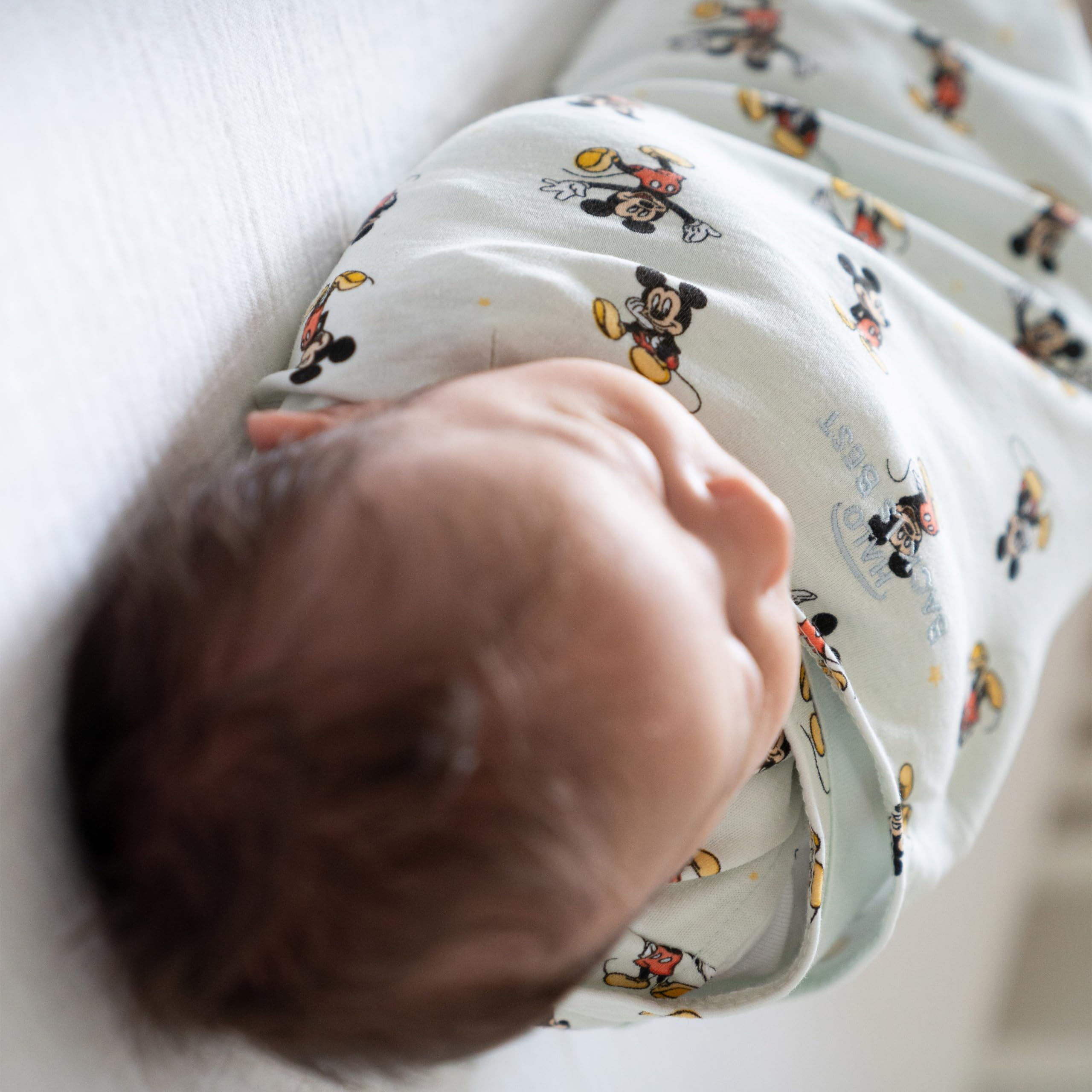 HALO inverted zipper enables easy diaper changes without disturbing baby.